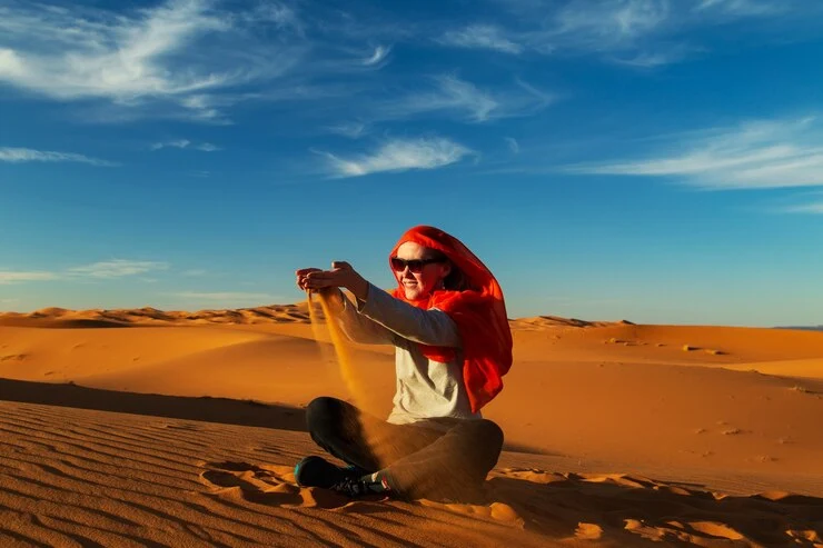women play in desert morocco